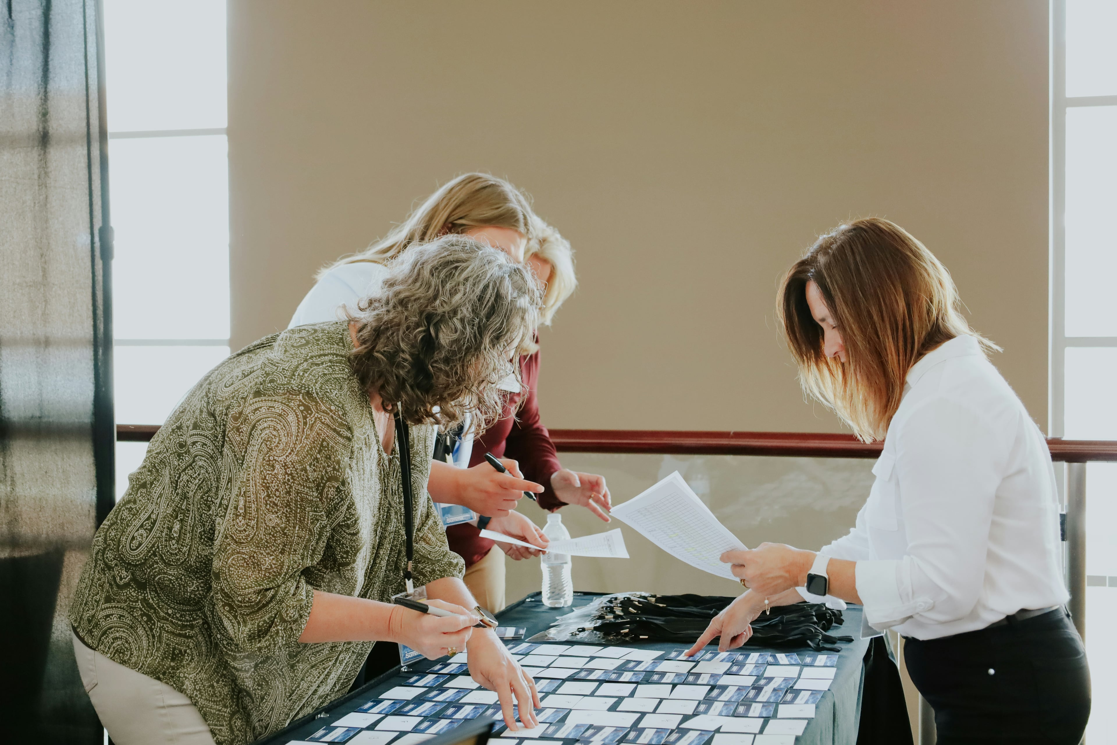 Decorative photograph of a conference hall used as a background.
